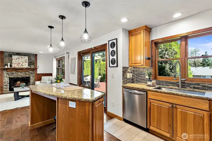 Bright kitchen featuring a spacious center island and ample natural light. Bright kitchen featuring a spacious center island and ample natural light.