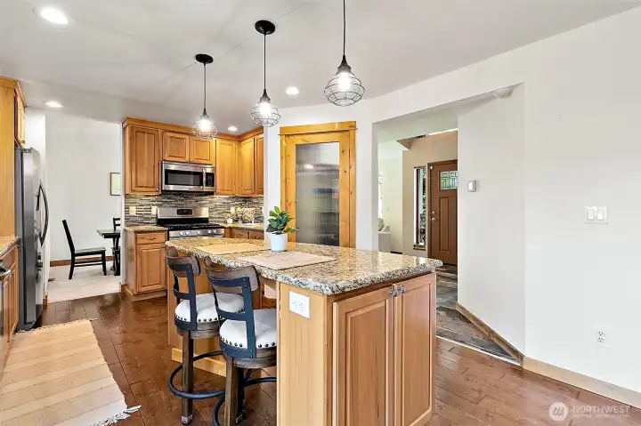 kitchen featuring a spacious eat-in island with seating for four. kitchen featuring a spacious eat-in island with seating for four.