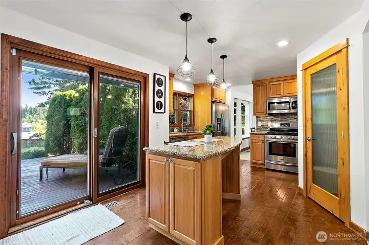 This kitchen features large windows that flood the space with an abundance of natural light. This kitchen features large windows that flood the space with an abundance of natural light.