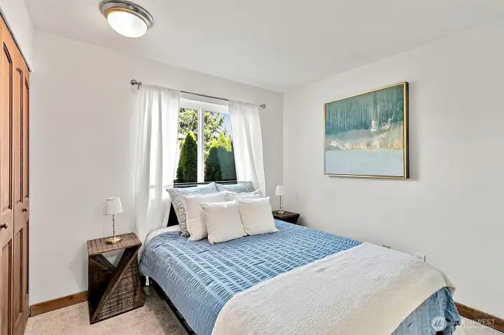 Main floor bedroom ideal for multi-generational living or a private home office. Main floor bedroom ideal for multi-generational living or a private home office.