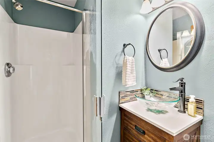 Main floor walk-in shower located adjacent to the main floor bedroom. Main floor walk-in shower located adjacent to the main floor bedroom.