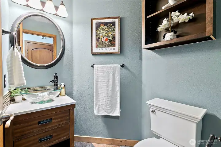 Main-level guest bathroom featuring contemporary fixtures and a bright, inviting aesthetic. Main-level guest bathroom featuring contemporary fixtures and a bright, inviting aesthetic.