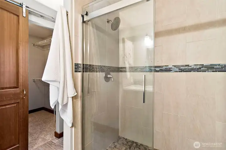 Expansive walk-in shower with premium finishes. Expansive walk-in shower with premium finishes.