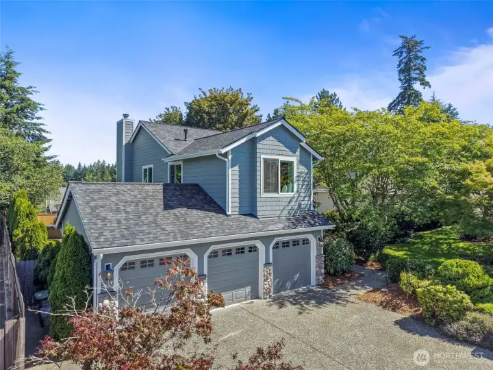 Three-car garage with an additional three-car driveway parking space. Three-car garage with an additional three-car driveway parking space.