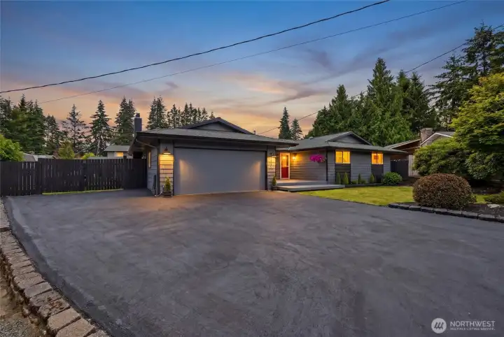 The freshly painted and sealed driveway not only is super spacious, but it adds to the curb appeal of this home with a nice sleek look
