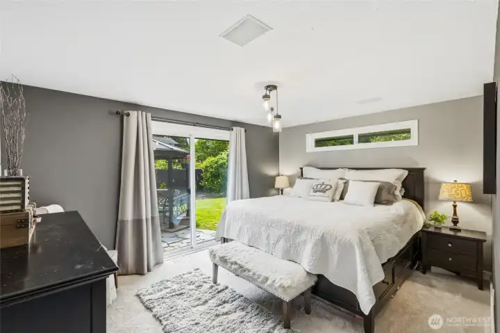 Primary bedroom with its own access to the backyard