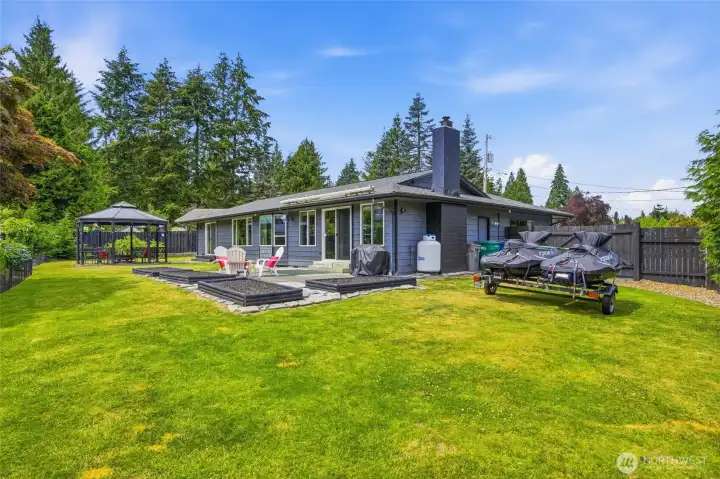 Garden bed, gazebo and plenty of space in this yard