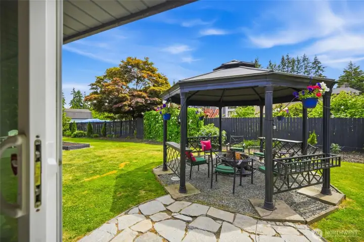 Step out of the primary suite to this amazing gazebo area