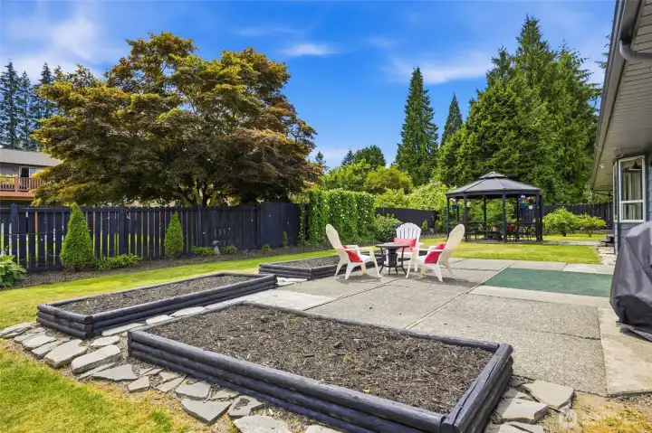 alternate patio view with raised garden beds, imagine all the things you could plant!