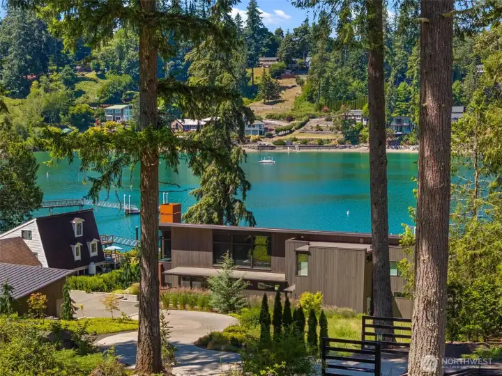 A picturesque landscape featuring towering trees, natural surroundings, and water views. A picturesque landscape featuring towering trees, natural surroundings, and water views.