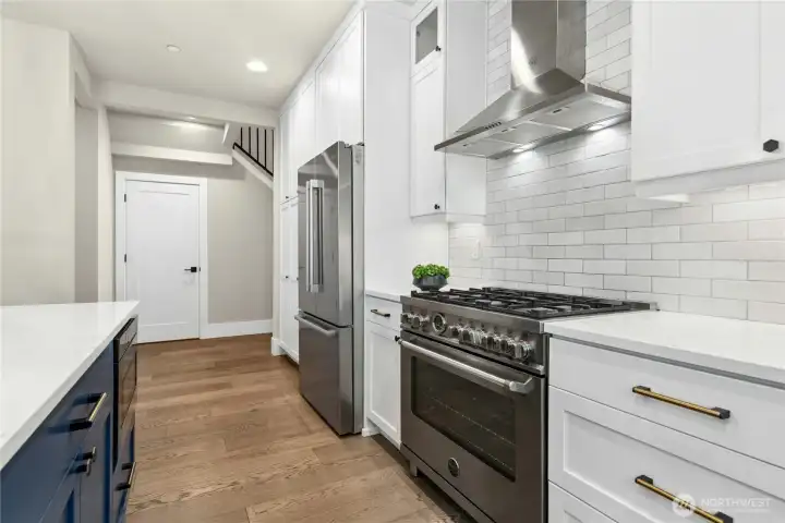 Chef's stove/oven, high powered vent fan, and built in microwave.