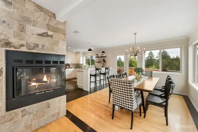 Fireplace is enjoyed from the dining and living spaces