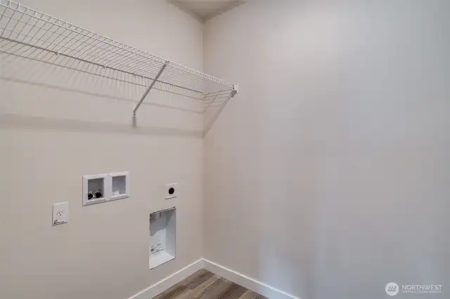 Photo not from actual home. Laundry room