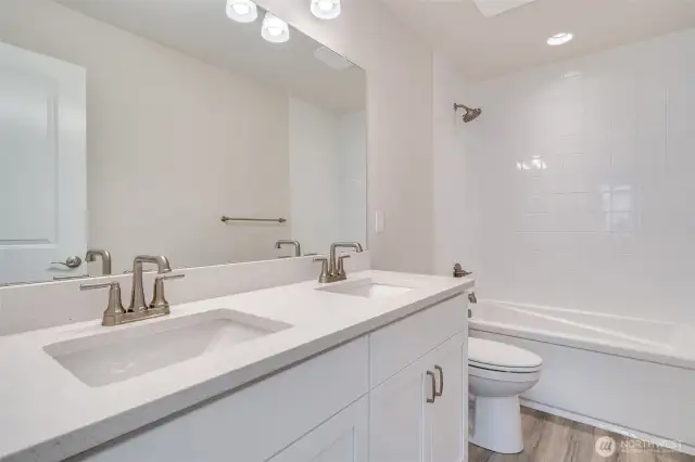 Photo not from actual home. Shared full bath