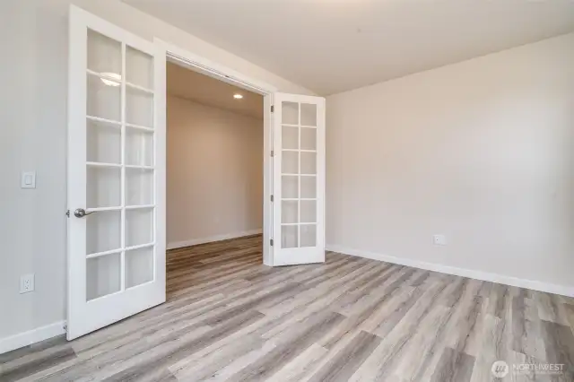 Photo not of actual home. Office/den french doors