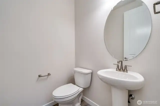Photo not of actual home. Main floor powder room.