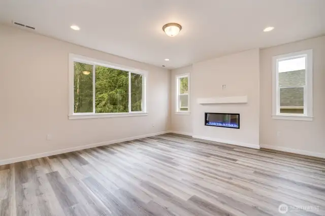 Photo not of actual home. Great room. Home will have gas fireplace