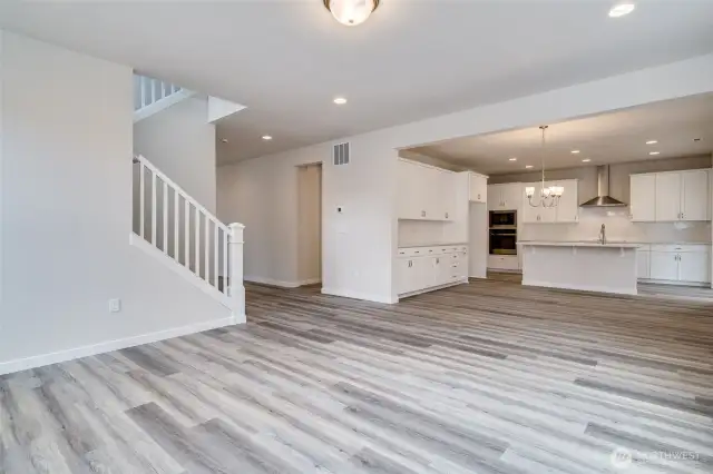 Photo not from actual home. Great room flows into kitchen