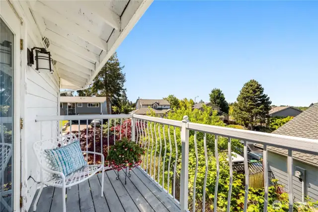 Through the double doors of the primary suite you'll find this delightful balcony. Perfect for taking in a long sunset over the Olympics.
