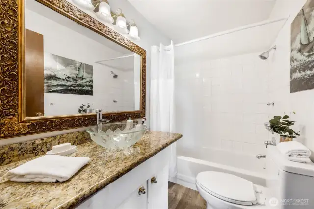 Shown here is the primary suite bath, with a few updates in recent years.