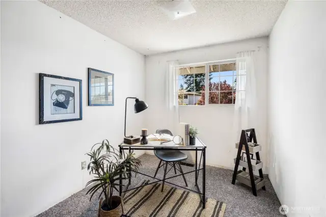 The second guest bedroom can also be used as a home office. It also looks out over the front yard.
