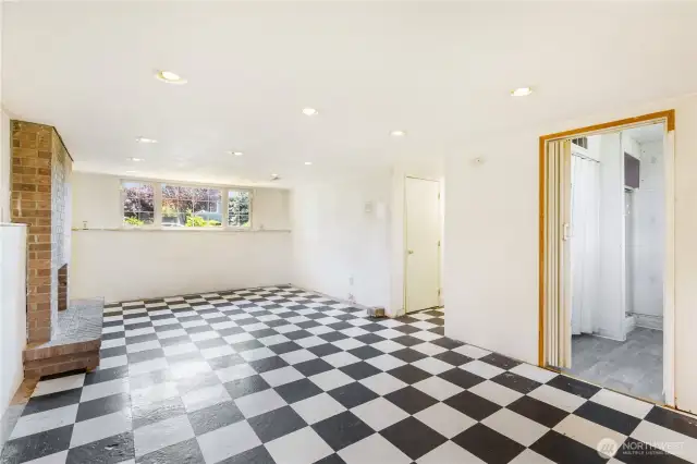Downstairs, a generous rec room awaits your ideas! The door on the right is to an adjoining 3/4 bath.