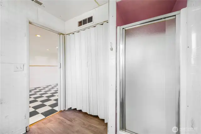 A view of the 3/4 bath just off the downstairs rec room.