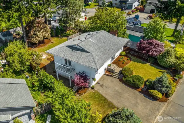 An aerial view of the property, showing its layout and spacious driveway.