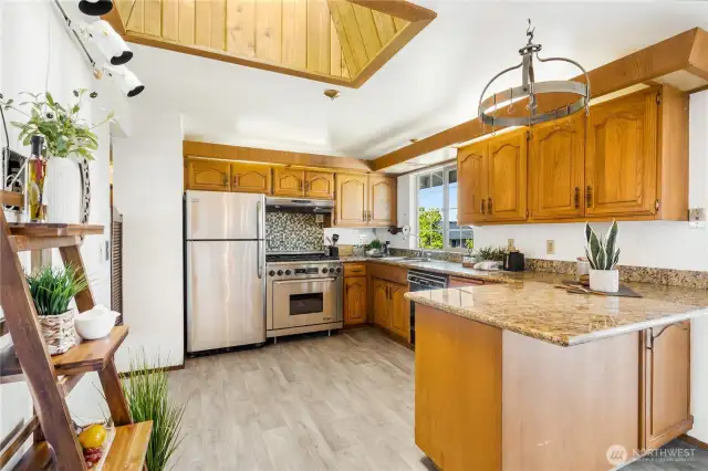 The kitchen features a large skylight that provides warmth and natural light year round.