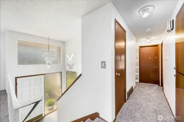 On the main level are three bedrooms, including the primary suite.