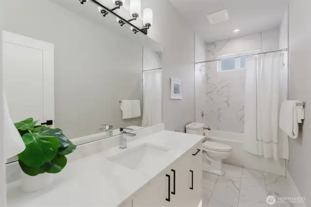 Large tiles keep these bathrooms gleaming