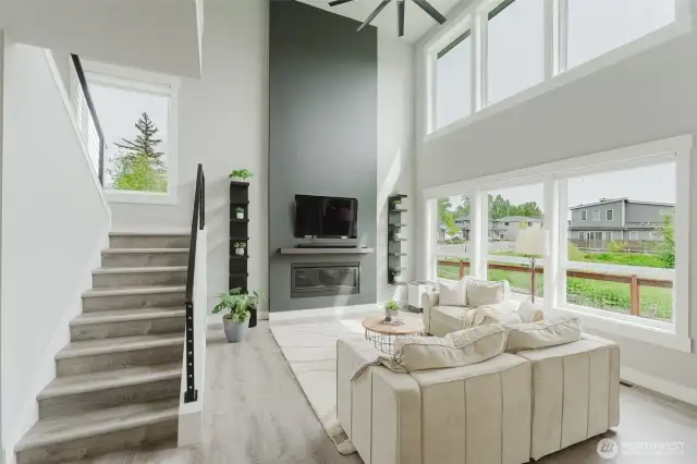 Large focal fireplace and southern windows create a bright and sunny living area