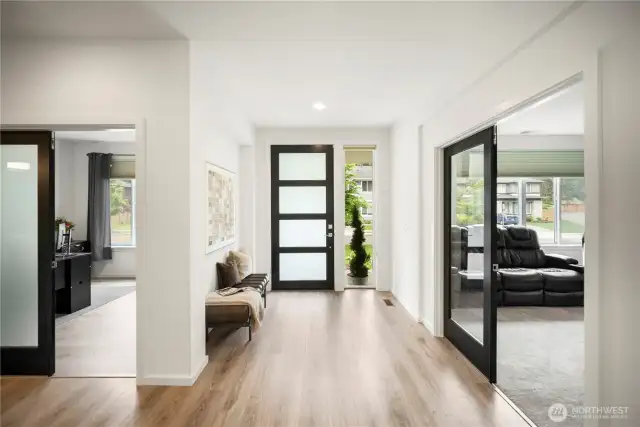 Entryway - here you can see an office with French doors to the left, and media room/den, to the right