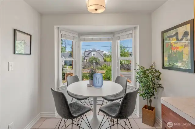 eat-in area of kitchen with bay windows