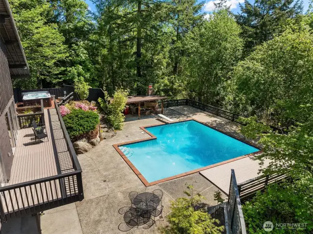 The oversized sliding door seamlessly connects indoor and outdoor living, opening to a spacious deck that overlooks your private oasis, perfect for relaxing or entertaining.