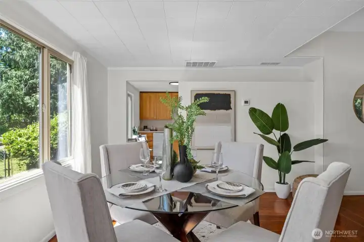 A warm connection between kitchen and dining makes entertaining effortless in this inviting home.