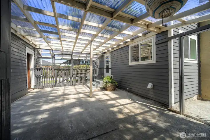 An enclosed breezeway offers endless possibilities—garden prep station, mudroom, or extra storage.