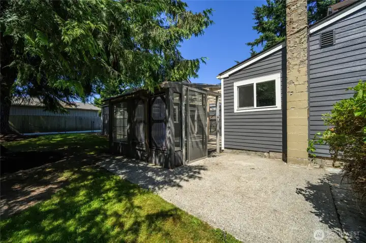A view of the back of the home reveals the covered patio and private outdoor spaces ready for your vision.
