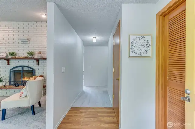 What a greeting! Durable LVP entry flooring for easy clean-up and coat closet (second door on the right) for convenience. The first door to your Right leads to the mud/utility room.
