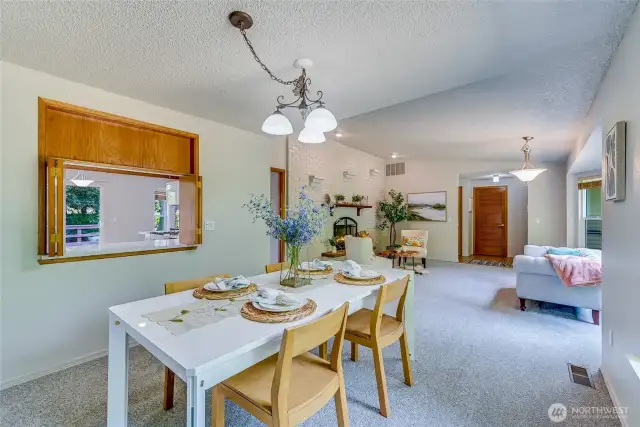 Another view from the Dining Room toward the Living Room. Reminder, this home has fresh paint and new carpet throughout!