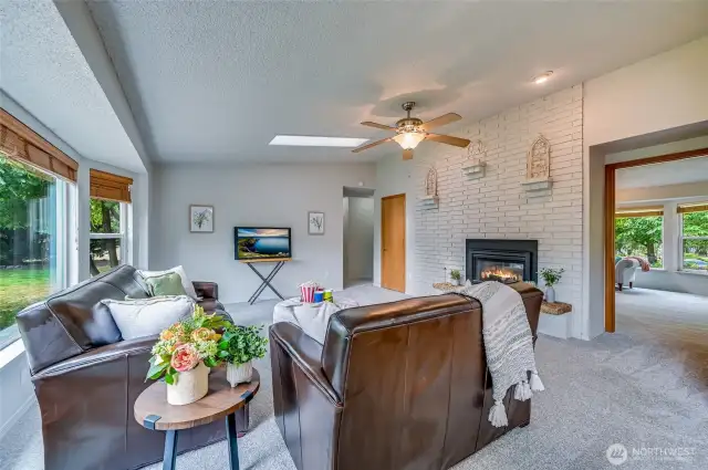 Thanks for waiting! Now you can find out all about this wonderful space. Another oversized vaulted room awaits your touch to make it your own. Ceiling fan helps keep the A/C cooled air or the warm gas fireplace air right where you want it. Cuddle up and enjoy the fireplace and/or cuddle up and have a nice movie night. Skylight keeps the room extra well lit! Again, fresh paint and new carpet here. The door in the background is a nice game or cleaning closet.