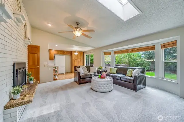 On our way to check out the bedrooms, we turn and see just how large this room is. Another bayed style window wall overlooks the gorgeous backyard.