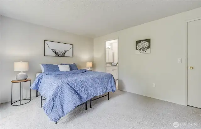 Second view of the Primary Bedroom. Door to the right is the walk-in closet. Near the front of the bedroom is the 3/4 Bathroom.