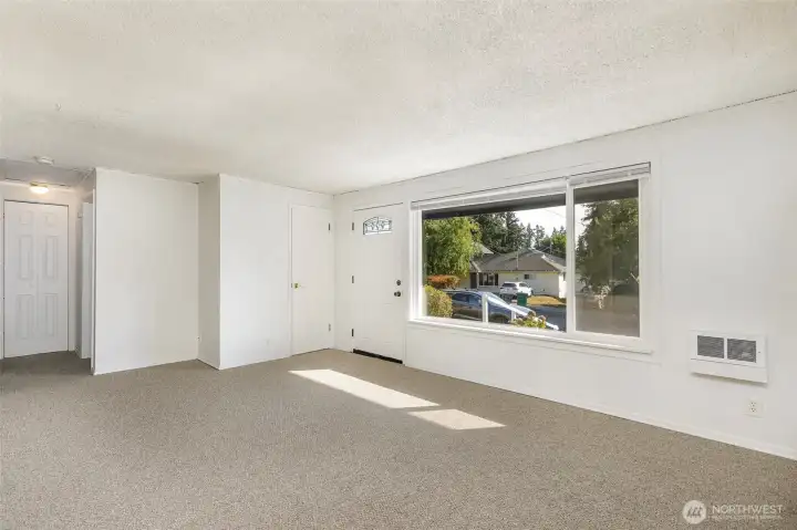 View from dining to entry & hallway to bedrooms
