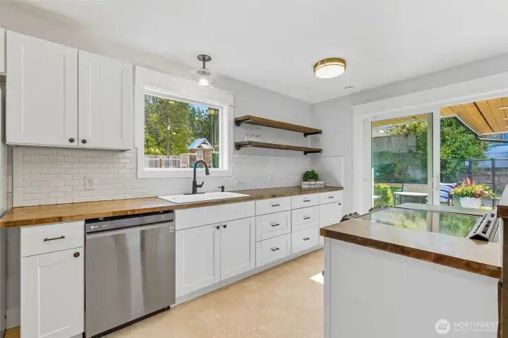 Kitchen has great light from the slider and window above the sink.