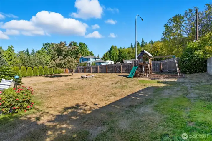 The large backyard is perfect for gardening or entertaining.