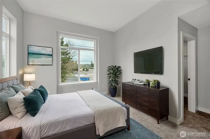 Bright and spacious primary bedroom - high ceilings (virtually staged)