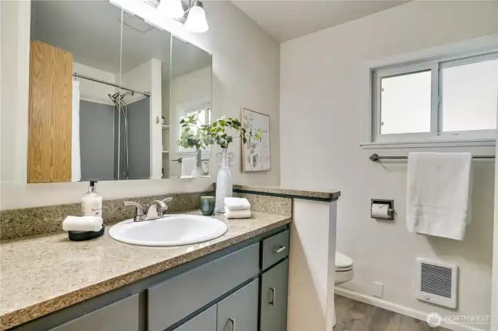 Newly updated bathroom on the main floor. Stone counters, updated lighting.
