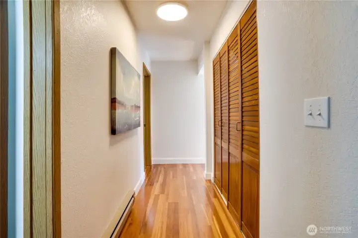 Hall on the main floor. To the right is washer/dryer, to the left, the bedroom and bathroom