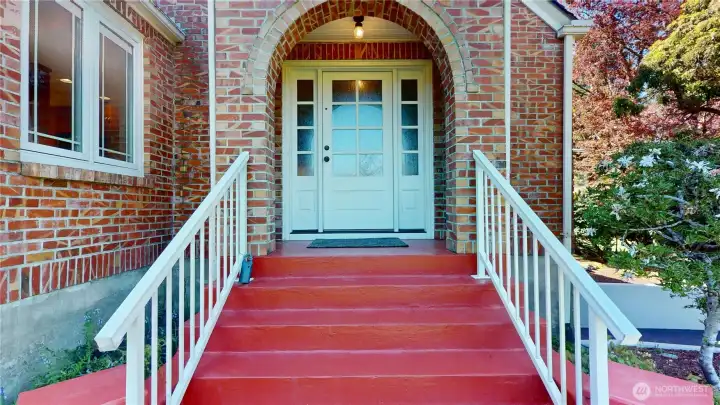 Steps to an arched entry greet you and your guests!